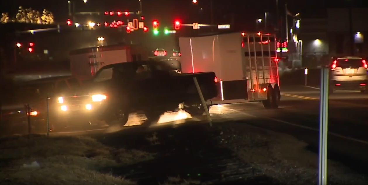 horse trailers at night.png