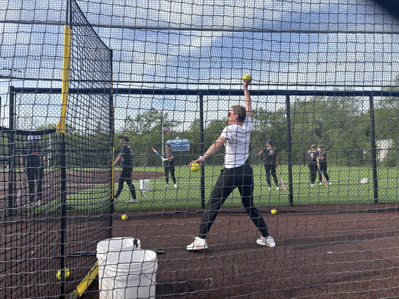 Hartford softball coach won't let ovarian cancer keep her off the field