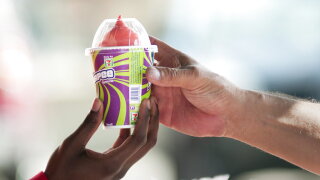A free Slurpee is handed out to a military service member.