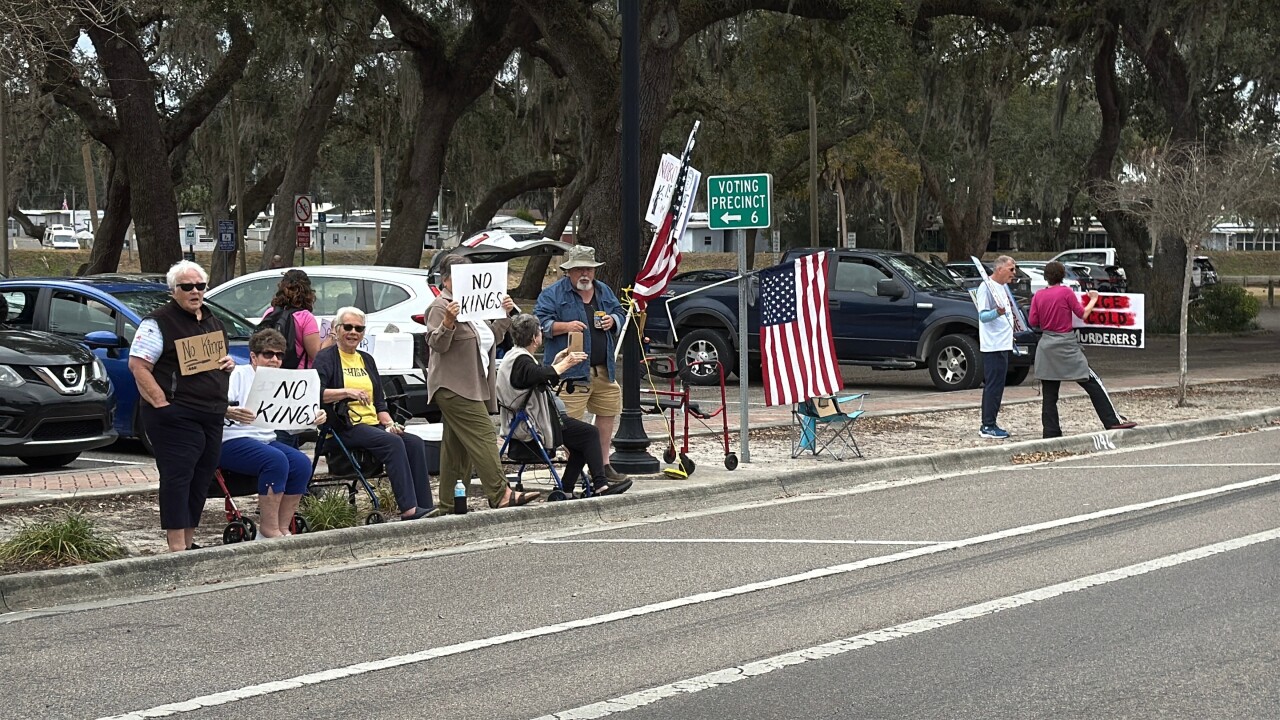 Over a dozen people held signs and made their voices heard