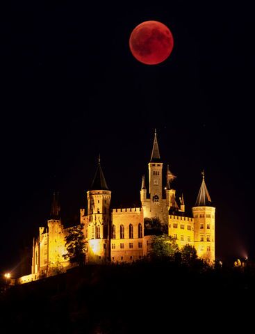 Photos: Lunar eclipse offers thrilling views of 'blood moon' across the world