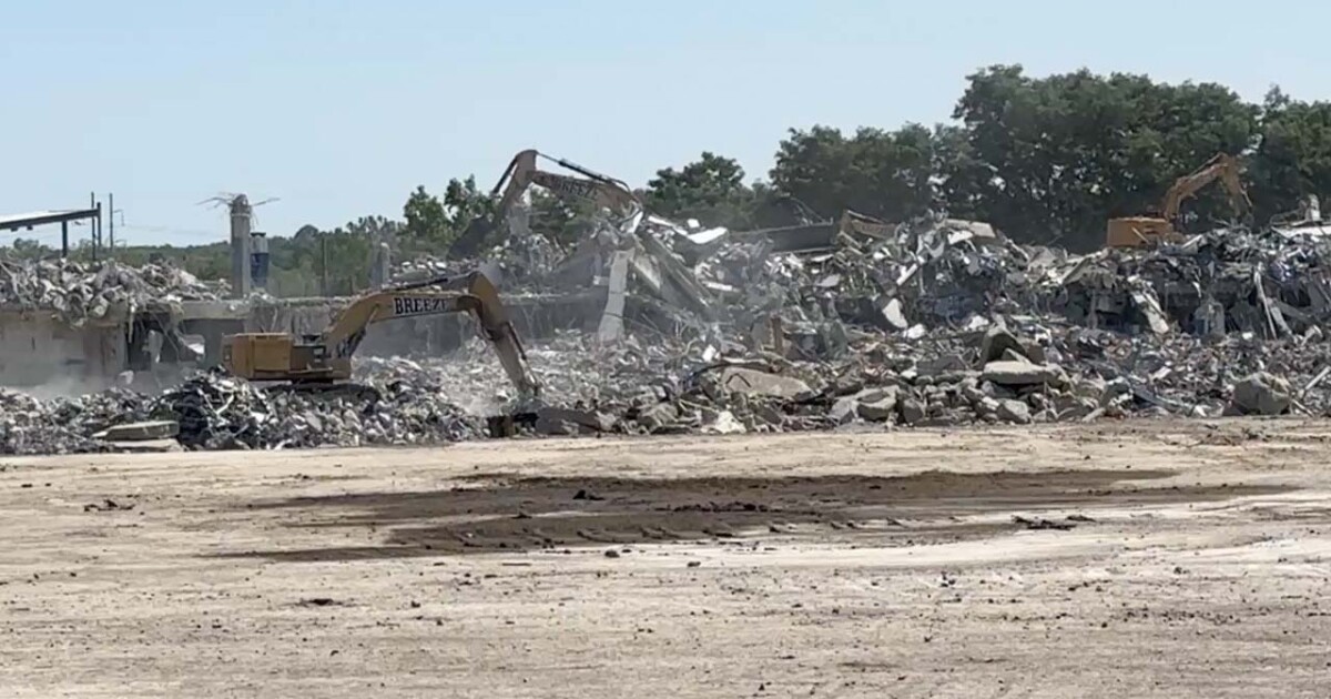 'So bittersweet': Buffalo Bills fans gather outside former Highmark Stadium as demolition continues