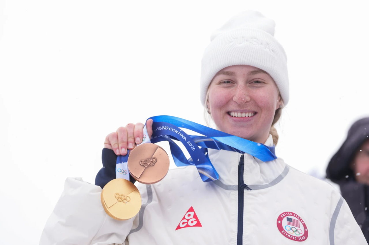 Bronze medalist United States' Elizabeth Lemley wears her gold medal alongside her bronze medal after the women's freestyle skiing dual moguls finals at the 2026 Winter Olympics, in Livigno, Italy, Saturday, Feb. 14, 2026. Lemley won the gold medal in women's moguls earlier that week.