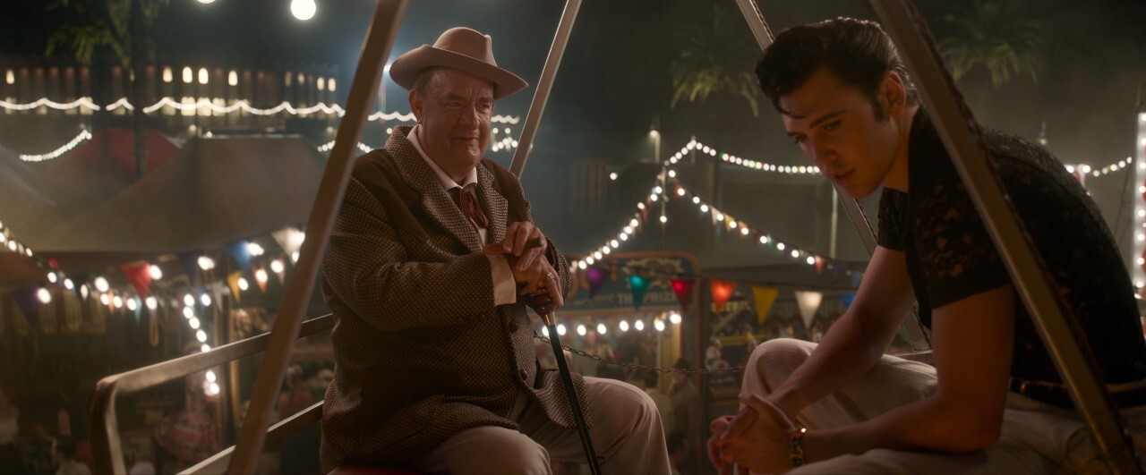 Tom Hanks as Col. Tom Parker and Austin Butler as Elvis Presley on Ferris wheel in scene from 'Elvis'