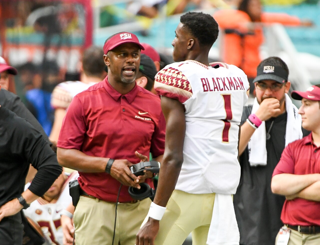 Florida State Seminoles head coach Willie Taggart speaks to QB James Blackman on sideline vs. Miami Hurricanes in 2018