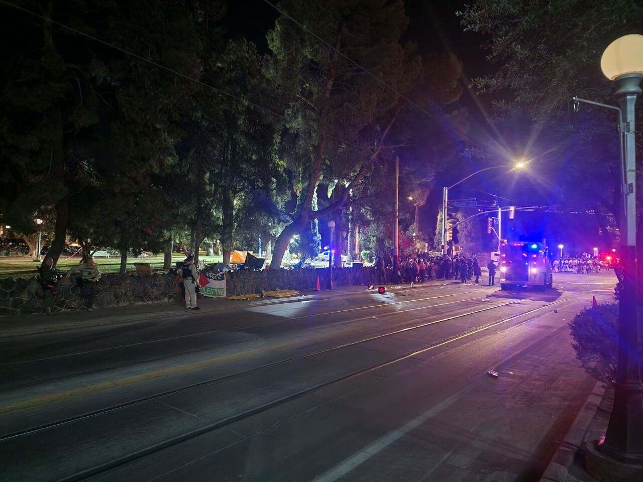 Protesters cleared from the area as police work to clean up