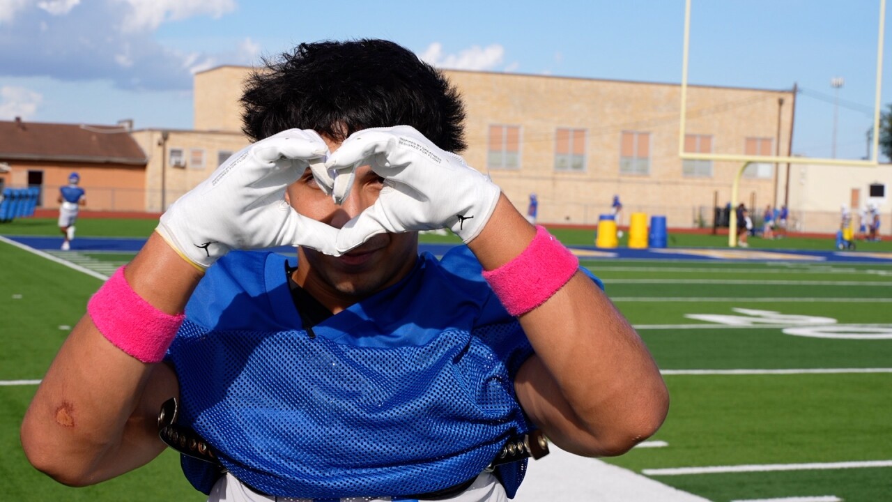 John Hinojosa gives a heart to his mom