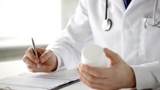 A video of a doctor writing a prescription