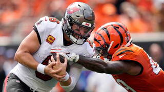 Cincinnati Bengals linebacker Barrett Carter (49) hits Tampa Bay Buccaneers quarterback Baker Mayfield (6) and causes a fumble in the first half of an NFL football game Sunday, Sept. 13, 2026, in Cincinnati. 