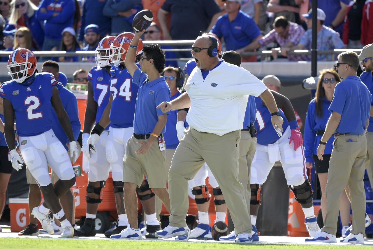 Florida Gators offensive line coach John Hevesy on sideline vs. Georgia Bulldogs in 2021