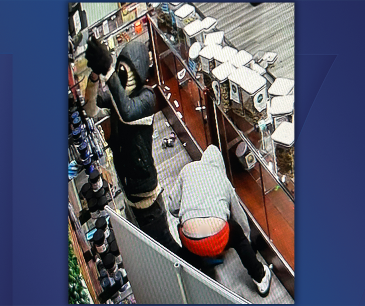 Blurred asset - Suspect 3 - Black jacket w cream or tan hoodie - Courtesy MSP Sixth District Lakeview Post.png