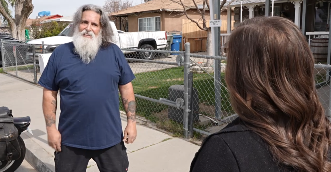 Neighborhood News Reporter Veronica Morley interviewing neighbor David Lane