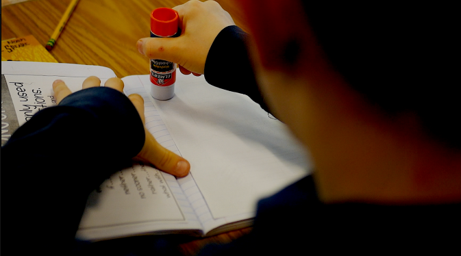 Students adding to grammar notebooks