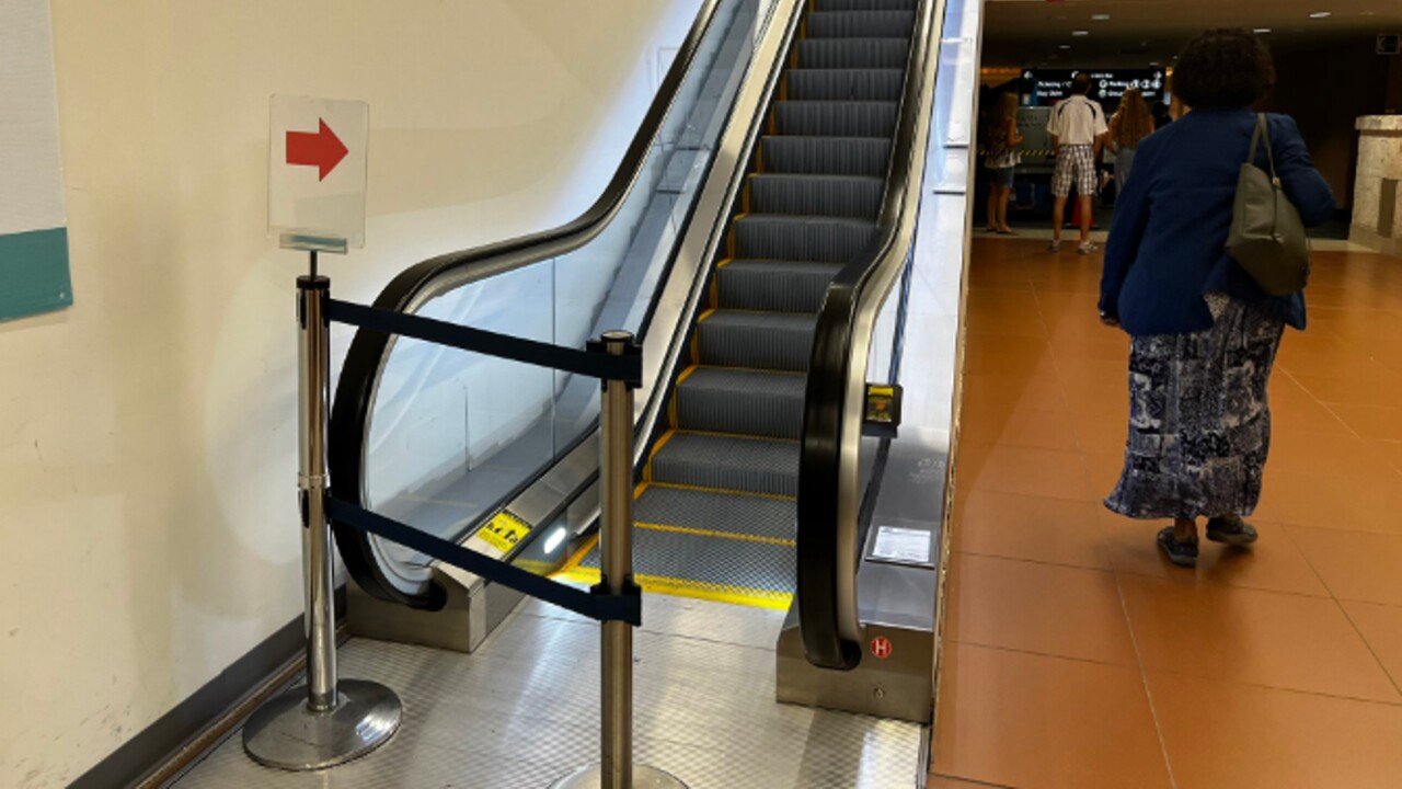 An escalator is blocked off at Palm Beach International Airport on Aug. 10, 2022.jpg