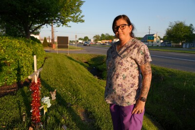 Amanda Sasser by her brother's memorial