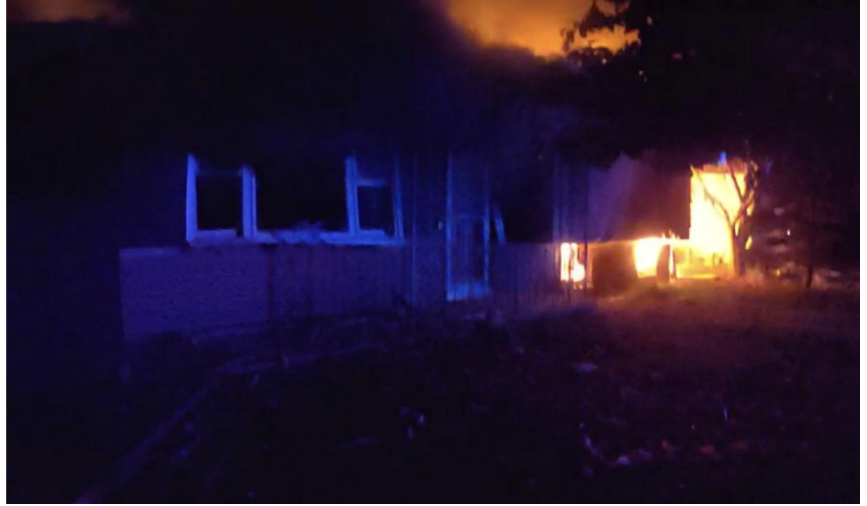 Flames engulf the home on Rockwell Road in Howard during the early morning hours of Nov. 6, 2025. Two sisters died in the fire.