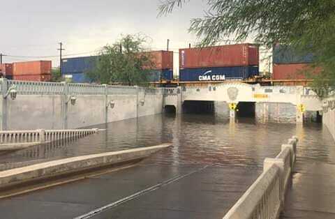 Lake Elimira forms during heavy monsoon storms in downtown Tucson