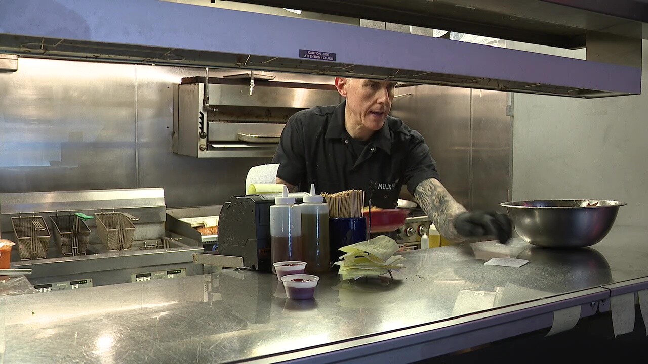 Melt owner Matt Fish works in the kitchen of his Lakewood restaurant on Monday.