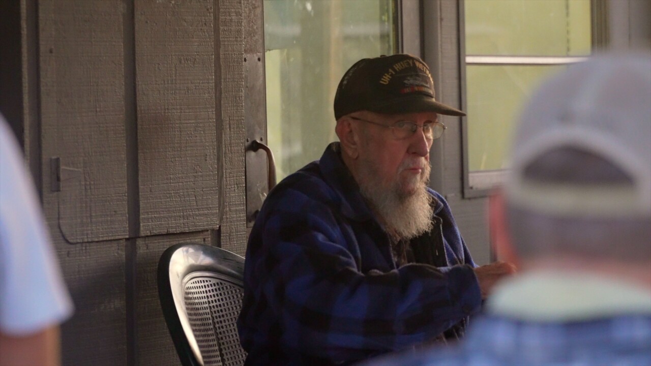 Dan Schreiber spending the final day of the Corkscrew Country Store's life on the porch. 