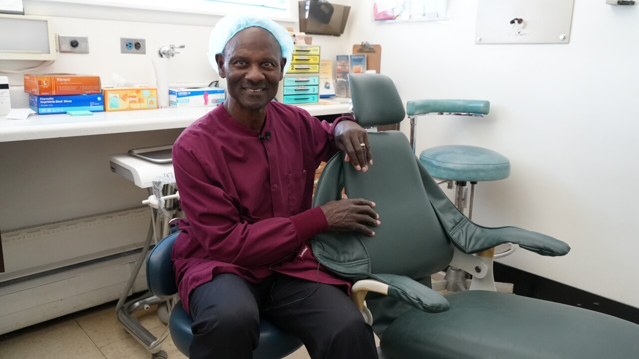 Dr. Richardson by a dental chair