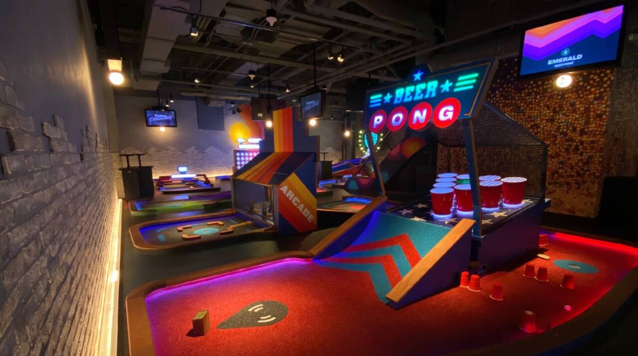 Featured here is the 'Beer Pong" hole and next to it is an arcade themed hole. 