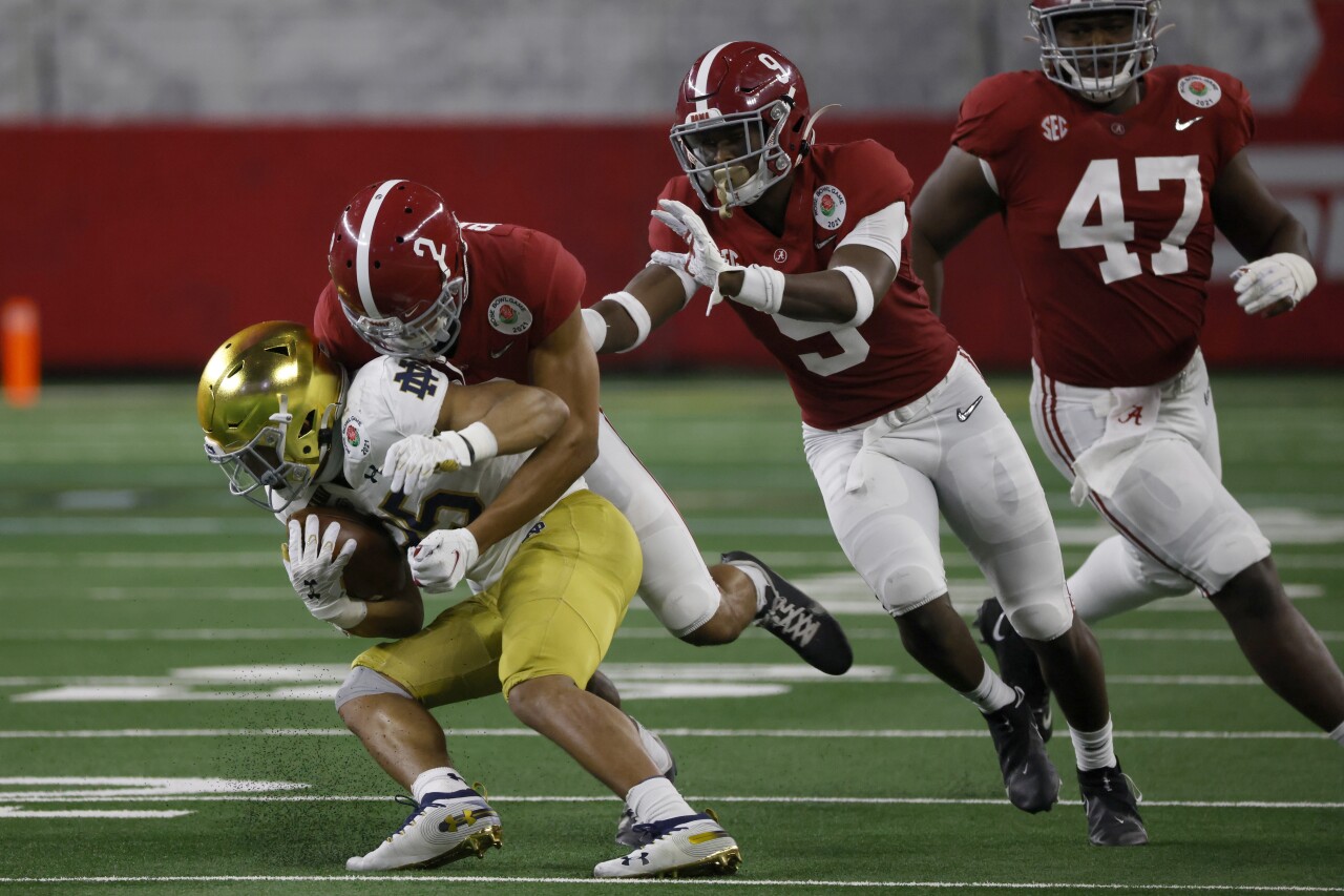 Alabama Crimson Tide cornerback Patrick Surtain II stops Notre Dame Fighting Irish running back Chris Tyree at College Football Playoff semifinal at Rose Bowl