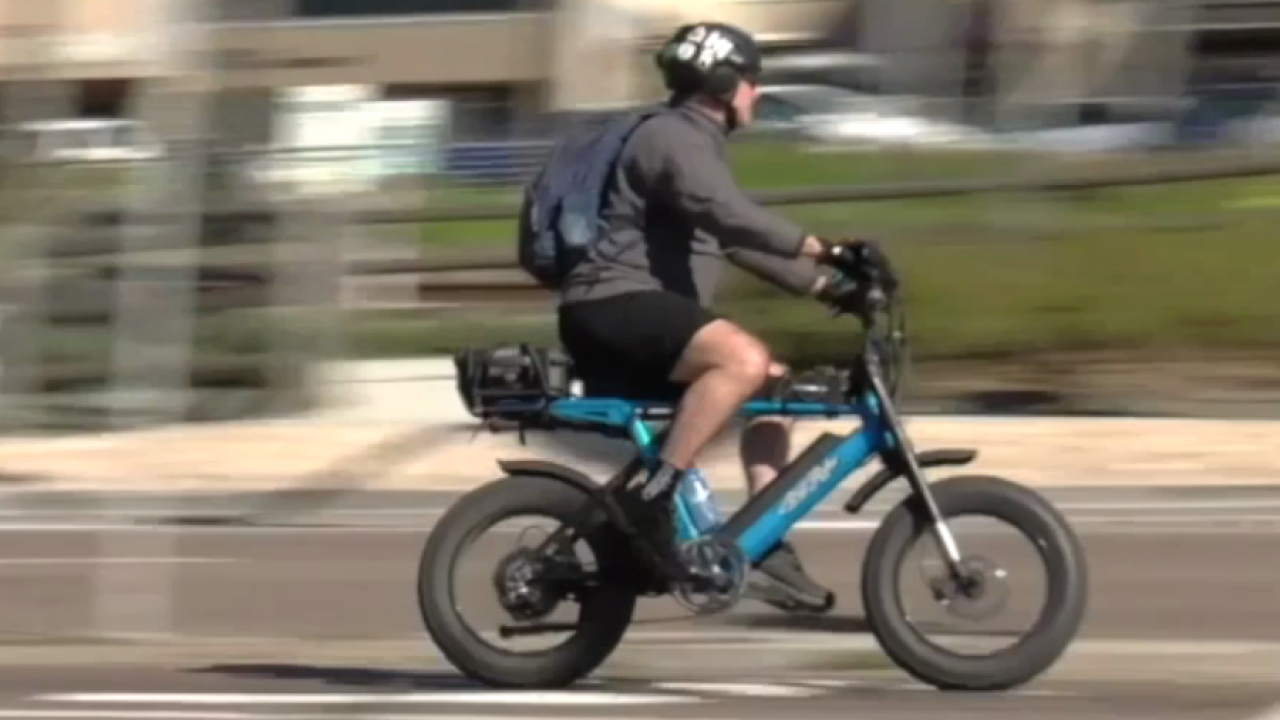 electric bicycle rider Schwinn Regent 27.5" Adult Hybrid Bike The Regent electric hybrid bike makes getting around easier and more comfortable than ever before Men's E-Bikes: All You Need
