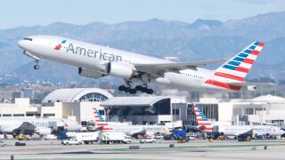 American Airlines plane takes off.