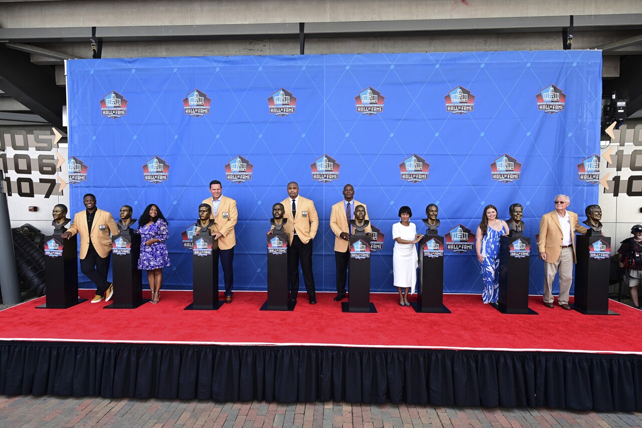 Pro Football Hall of Fame class of 2022 pose with their busts
