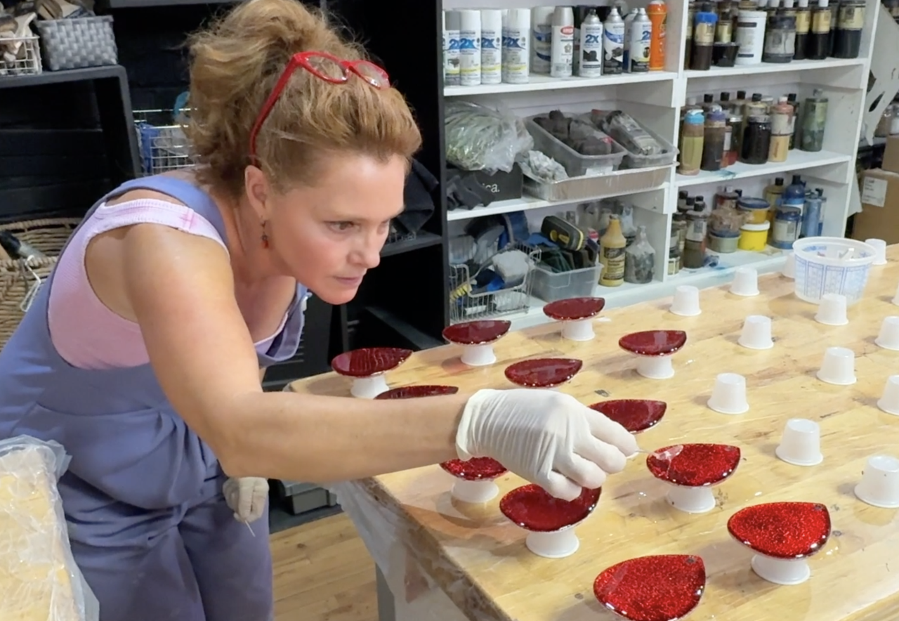 Tiffany Luke creating the Silver Bells in the City ornament