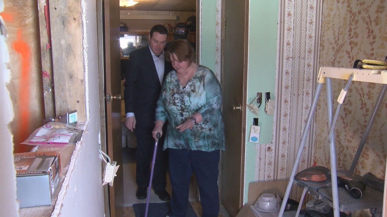 Hulme shows Chief Investigative Reporter Eric Ross her incomplete master bedroom (FILE 2019)