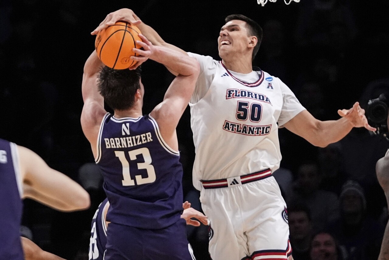 Florida Atlantic Owls center Vladislav Goldin blocks shot by Northwestern Wildcats guard Brooks Barnhizer in first half of NCAA tournament, March 22, 2024