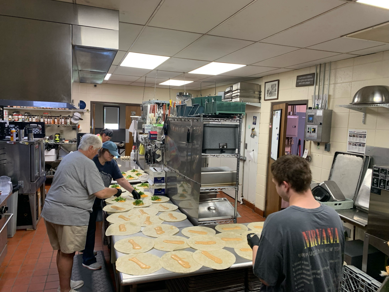 Volunteers helping prepare meals