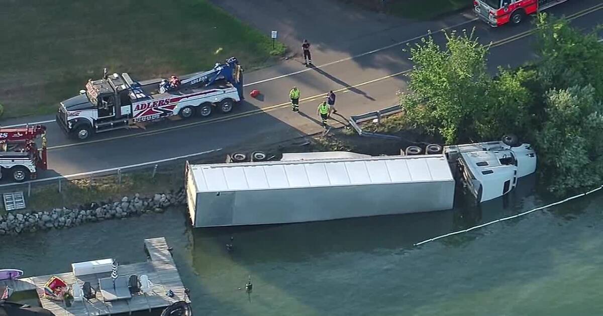 Workers clean gas leak after semi-truck flips in Pine Lake, no injuries reported