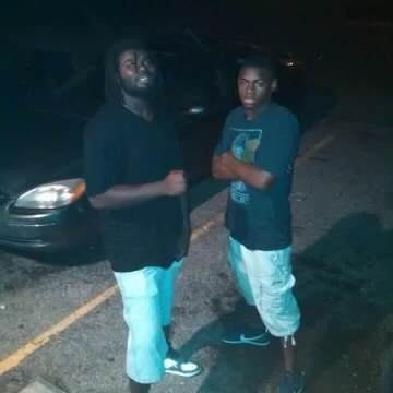 This is the last photo that Rodney Walker has with his older brother before his brother was killed. In the photo, they are standing side by side.