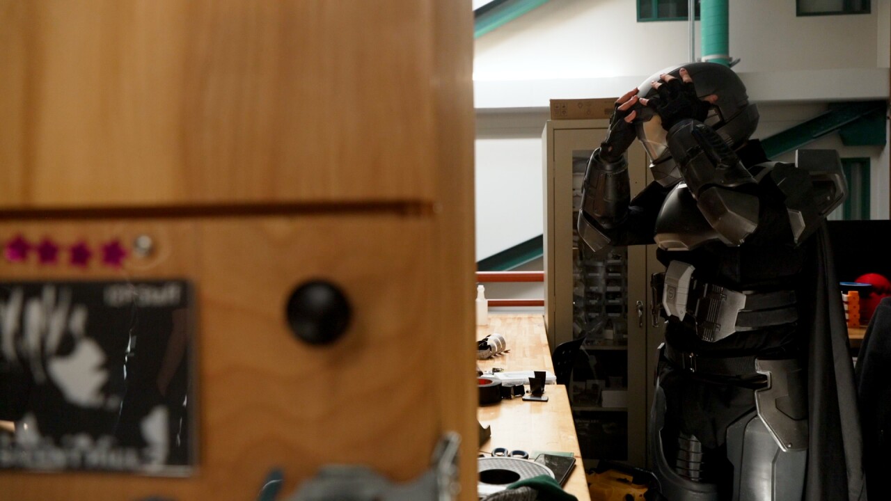 Kang trying on design.jpg