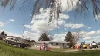 People remove barriers to drive through work zone in Great Falls