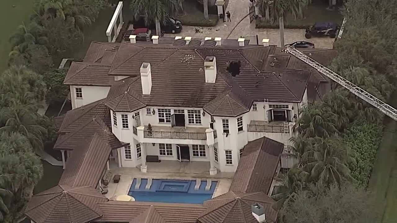 Tyreek Hill's house with gaping hole in roof after fire in Southwest Ranches, Jan. 3, 2023
