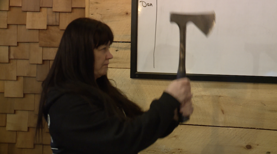 Debi Wood says she prefers throwing axes with both hands instead of one-handed