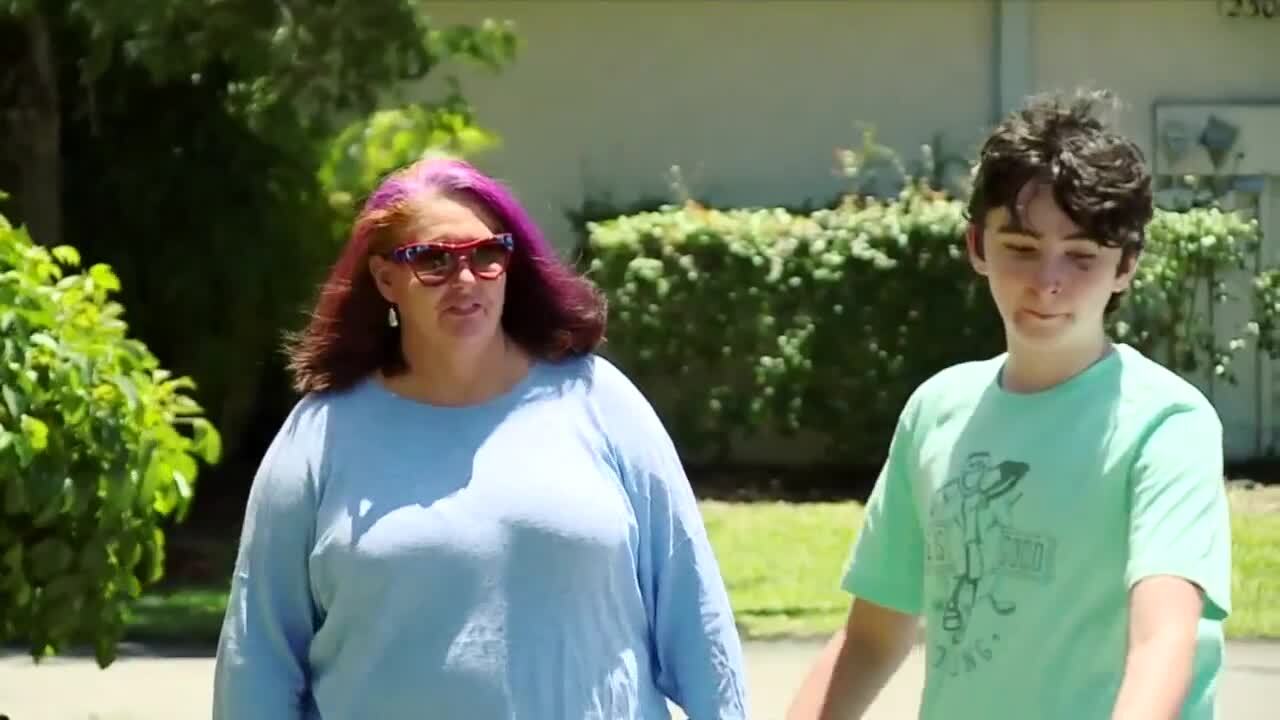 Karin Smith and son walking their dog