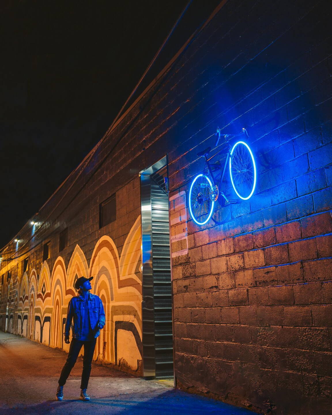 Lit bike and mural