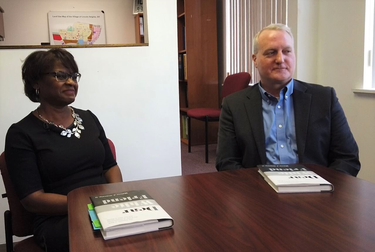 Joyce Powdrill, left, and Tom Carroll sit in Powdrill's office at Lincoln Heights.