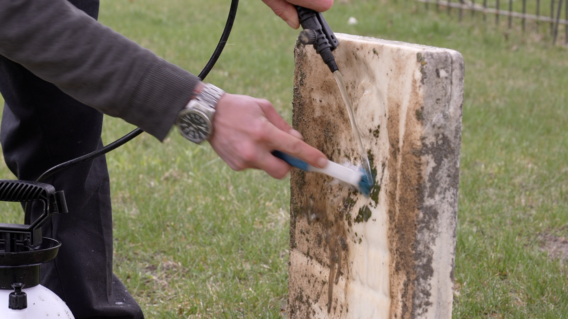 Cleaning gravestones in Mt. Rest Cemetery in St. Johns