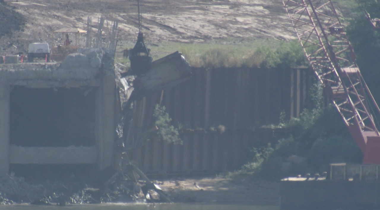 Crews use barge-mounted crane to remove debris at Beckjord on Sept. 17, 2021.