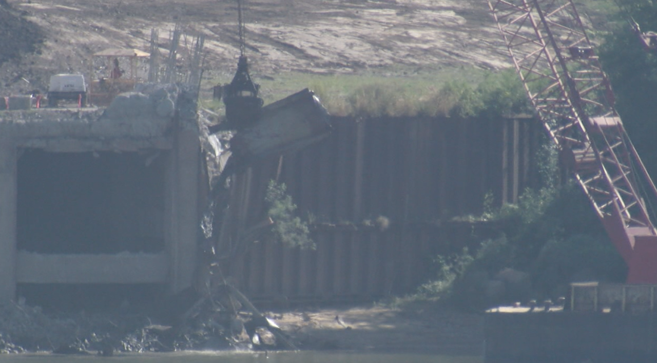 Crews use barge-mounted crane to remove debris at Beckjord on Sept. 17, 2021. 