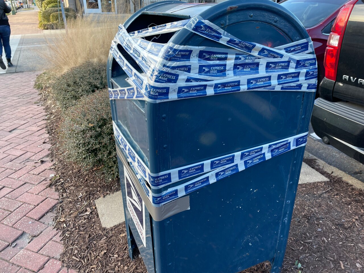 USPS collection bins taped across Hampton Roads