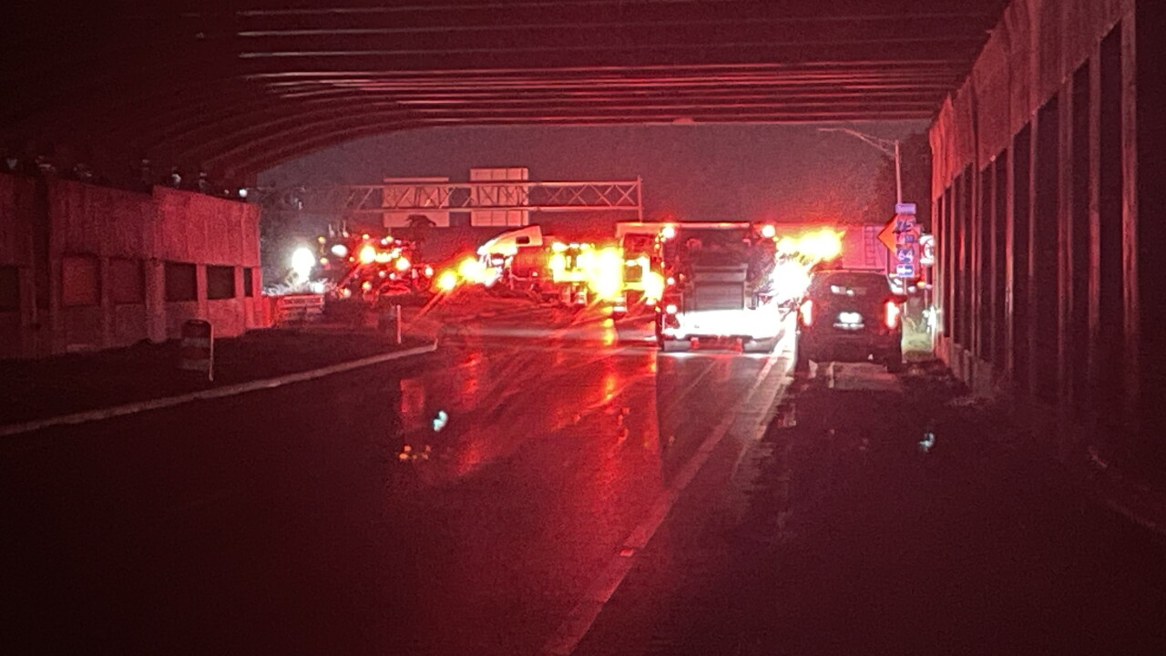 Car lodged under semi near Newtown Pike and I-75