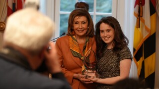 Nancy Pelosi with her mother's Hall of Fame award