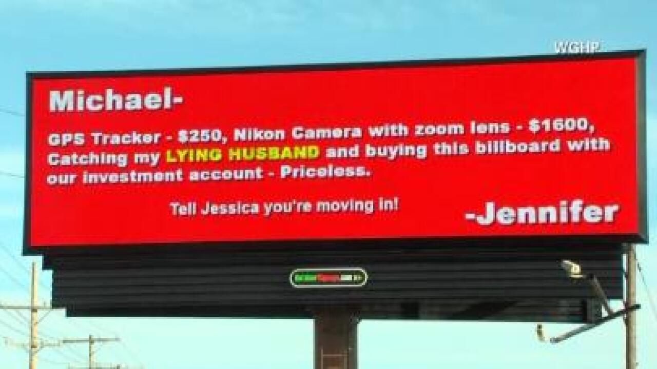 Cheating husband caught on billboard