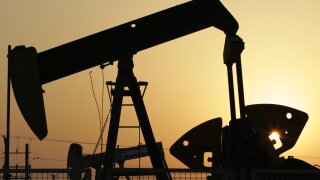  In this Sept. 30, 2015, file photo, oil pumps work in the desert oil fields.